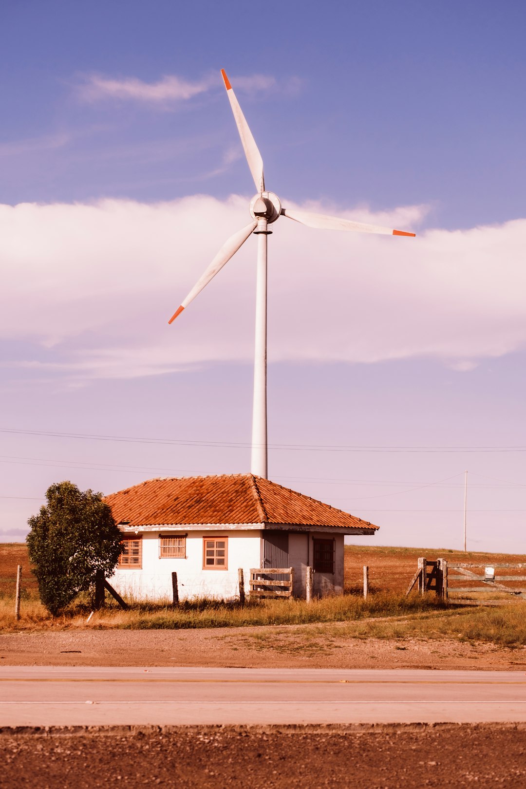 a-house-with-a-windmill-in-the-background-y46j9-6nlqa